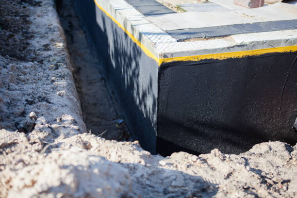 Professional Waterproofing technician working in Fishers, NY